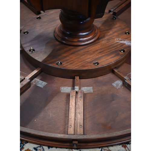 875 - A large George IV style circular extending mahogany dining table by Arthur Brett model 2239 'Mayfair... 