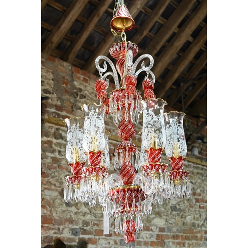 877 - A contemporary Murano style glass, gilt and cranberry glass chandelier / electrolier, with six arms,... 