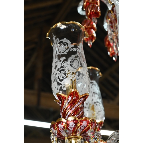 877 - A contemporary Murano style glass, gilt and cranberry glass chandelier / electrolier, with six arms,... 