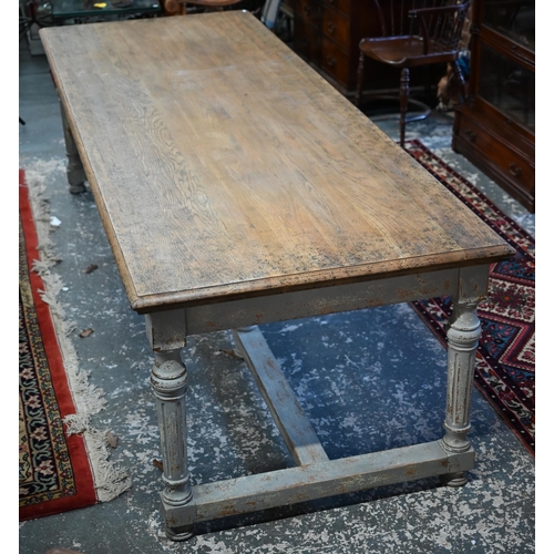 879 - A large contemporary oak top refectory dining table, raised on a distressed grey painted base of six... 