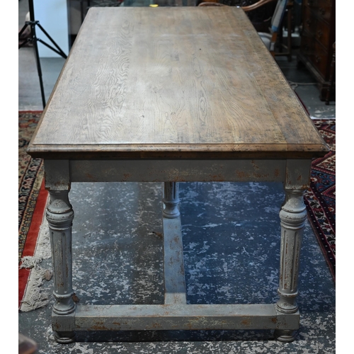 879 - A large contemporary oak top refectory dining table, raised on a distressed grey painted base of six... 