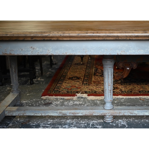 879 - A large contemporary oak top refectory dining table, raised on a distressed grey painted base of six... 