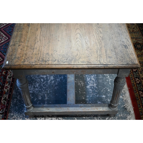 879 - A large contemporary oak top refectory dining table, raised on a distressed grey painted base of six... 