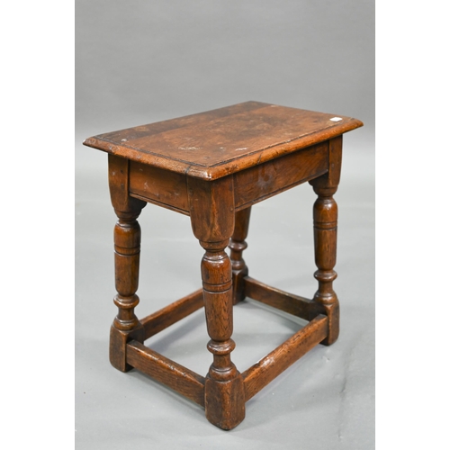 882 - An antique oak joint stool