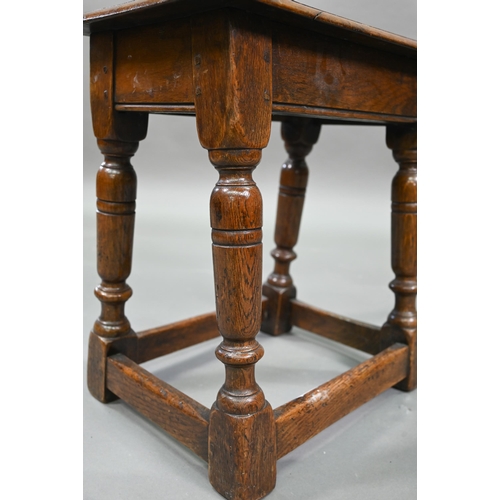 882 - An antique oak joint stool