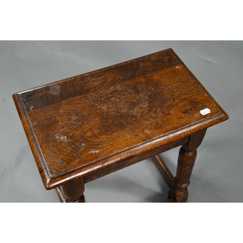 882 - An antique oak joint stool