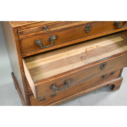 884 - An 18th century mahogany chest with a full width slide over four long graduated drawers, each with (... 