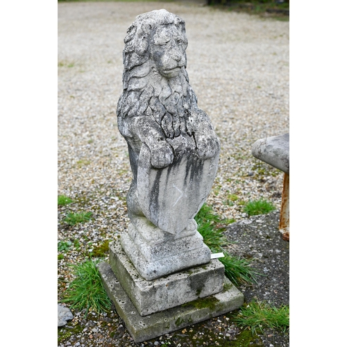 895 - A weathered cast stone armorial standing lion with shield, raised on a stepped a square base, 98 cm ... 