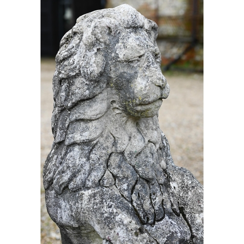 895 - A weathered cast stone armorial standing lion with shield, raised on a stepped a square base, 98 cm ... 