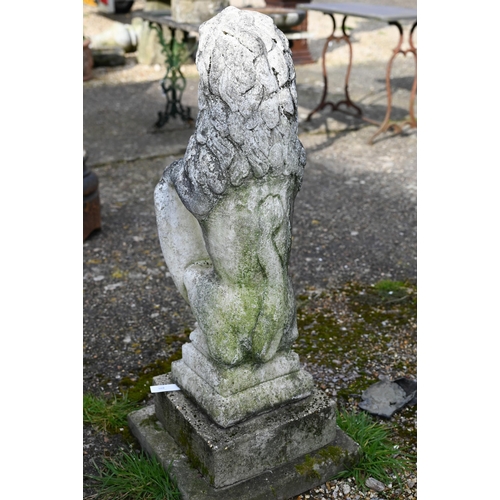 895 - A weathered cast stone armorial standing lion with shield, raised on a stepped a square base, 98 cm ... 