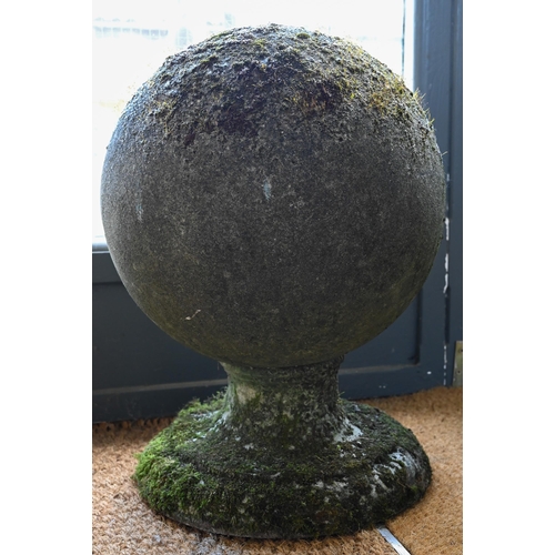 898 - A large pair of weathered old cast stone ball finials, 37 cm dia. raised on circular socle bases, 50... 