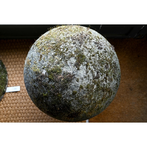 898 - A large pair of weathered old cast stone ball finials, 37 cm dia. raised on circular socle bases, 50... 