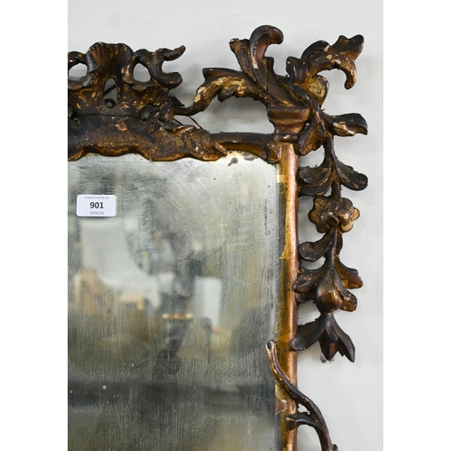 901 - A George III carved and moulded giltwood framed mirror, the plate displaying patination through age,... 