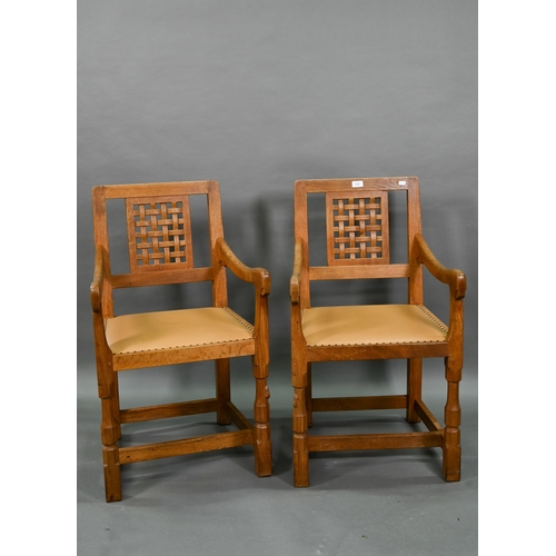 912 - The workshop of Robert Thompson (Kilburn) a companion pair of 'Mouseman' oak carver chairs with latt... 