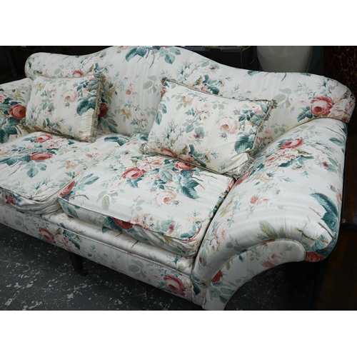 916 - A Georgian style hump back scroll arm sofa, in floral Colefax & Fowler fabric, raised on three f... 