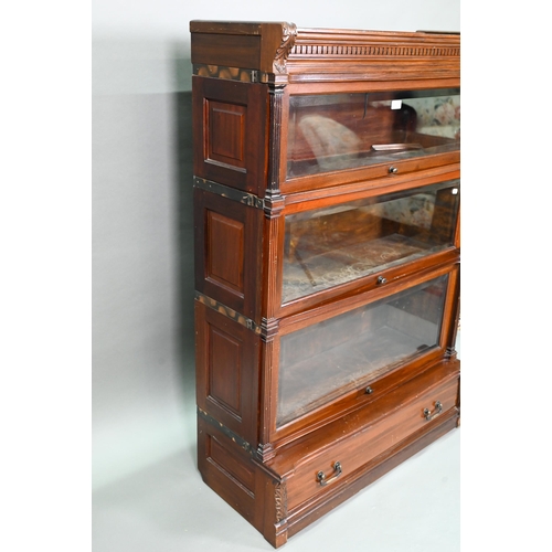 917 - A companion pair of mahogany Globe Wernicke library bookcases, each with moulded tops over three gra... 