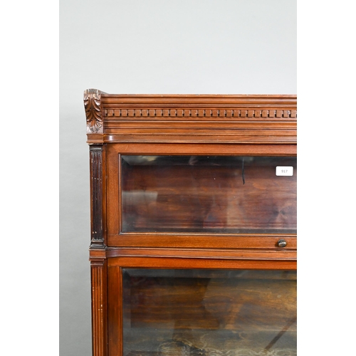 917 - A companion pair of mahogany Globe Wernicke library bookcases, each with moulded tops over three gra... 