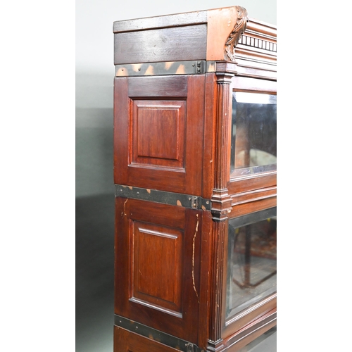 917 - A companion pair of mahogany Globe Wernicke library bookcases, each with moulded tops over three gra... 