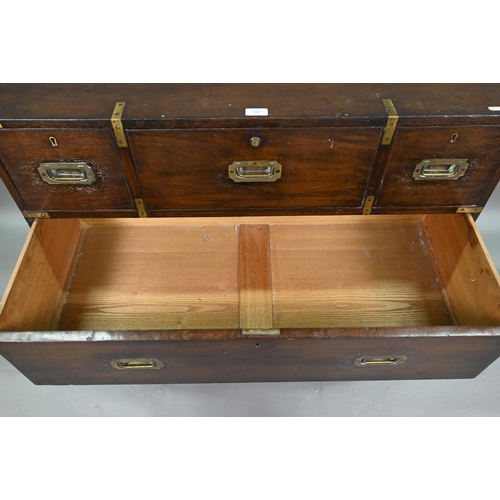 924 - A Victorian brass bound teak campaign secretaire chest, in two parts, centred by a fitted fall front... 