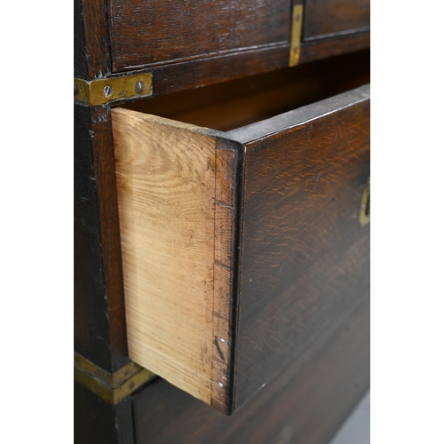 924 - A Victorian brass bound teak campaign secretaire chest, in two parts, centred by a fitted fall front... 