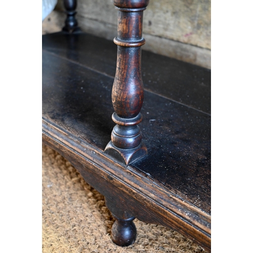 925 - An antique oak low dresser with three double moulded front drawers over a triple arched apron, raise... 