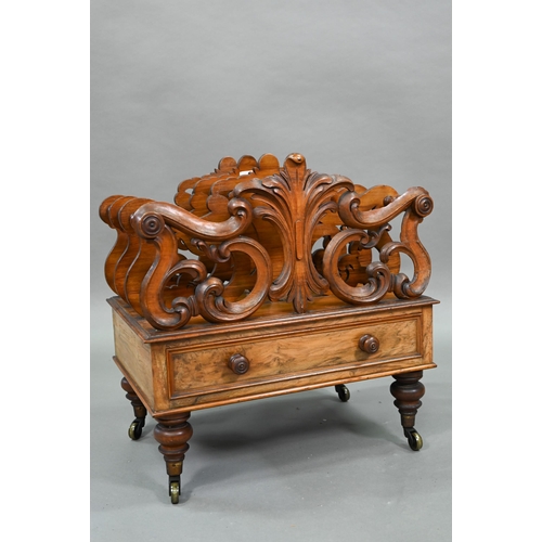 926 - A late Victorian walnut Canterbury, the four moulded and fret cut divisions over a base drawer, on b... 