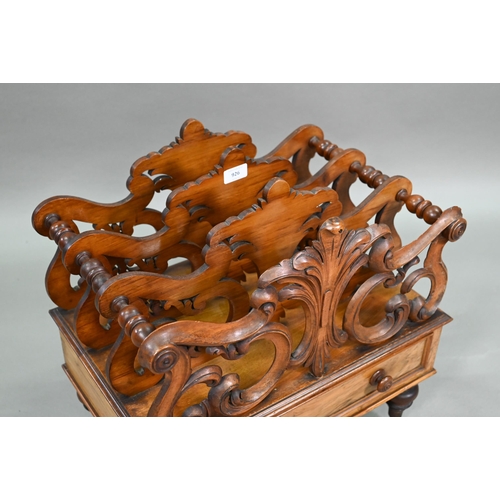 926 - A late Victorian walnut Canterbury, the four moulded and fret cut divisions over a base drawer, on b... 