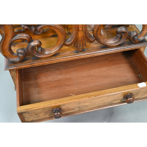 926 - A late Victorian walnut Canterbury, the four moulded and fret cut divisions over a base drawer, on b... 