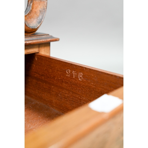 926 - A late Victorian walnut Canterbury, the four moulded and fret cut divisions over a base drawer, on b... 