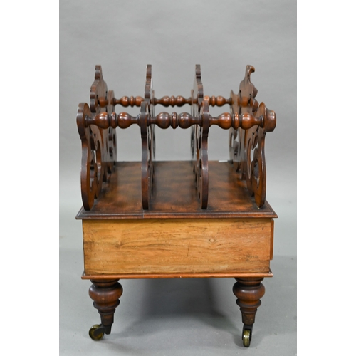 926 - A late Victorian walnut Canterbury, the four moulded and fret cut divisions over a base drawer, on b... 