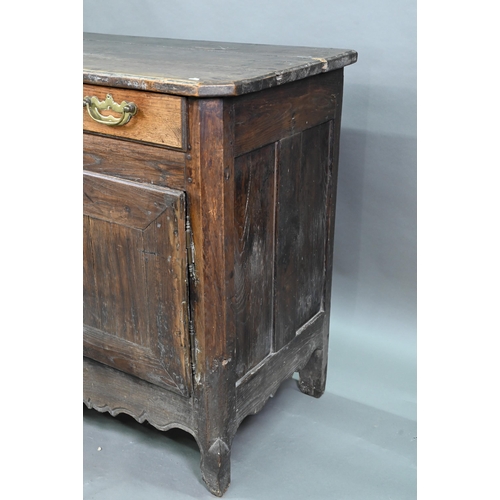 928 - An antique provincial French oak cupboard, Normandy, with three drawers over a pair of mitre framed ... 