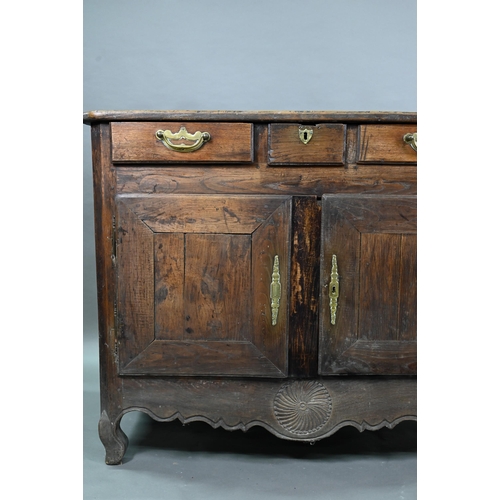 928 - An antique provincial French oak cupboard, Normandy, with three drawers over a pair of mitre framed ... 