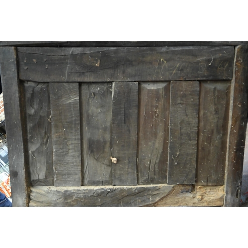 928 - An antique provincial French oak cupboard, Normandy, with three drawers over a pair of mitre framed ... 