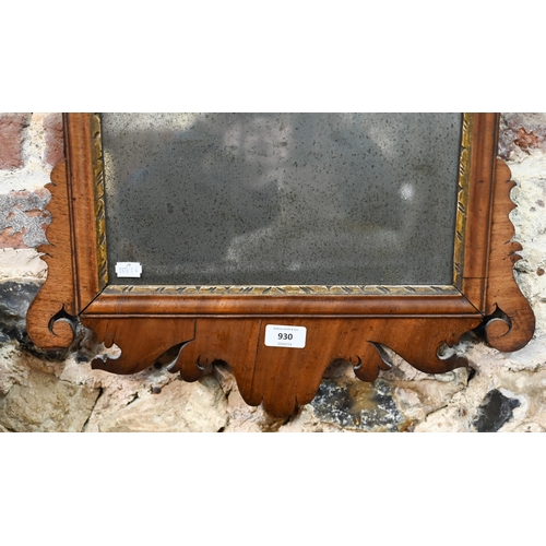 930 - An antique fret-cut wall mirror, surmounted by a ho-ho bird, the silvered plate tarnished with age, ... 