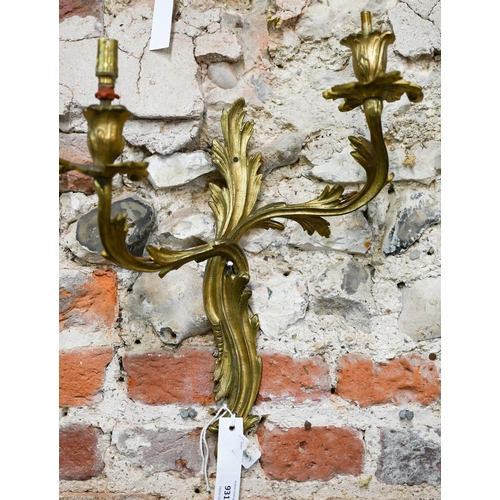 931 - A pair of Rococo style two branch ormolu wall sconces, 42 cm h, bright but tarnished, one arm missha... 