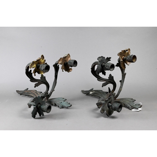 932 - A pair of three arm candle wall sconces in the Rococo style, dull gilt patinated finish, 40 cm h (2)