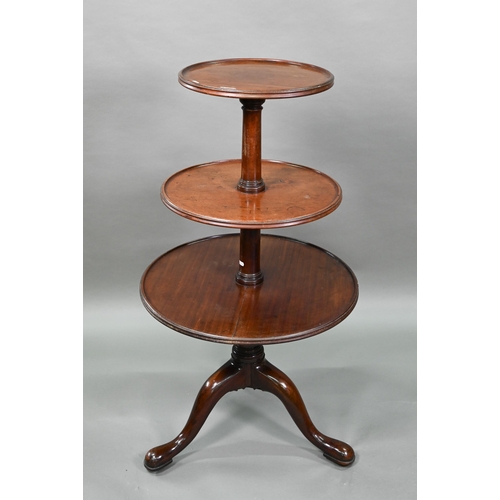 934 - A Victorian mahogany dumb waiter, the graduated three circular tiers raised on a tripod base to bras... 