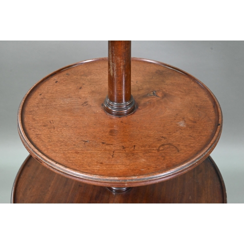 934 - A Victorian mahogany dumb waiter, the graduated three circular tiers raised on a tripod base to bras... 