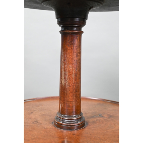 934 - A Victorian mahogany dumb waiter, the graduated three circular tiers raised on a tripod base to bras... 