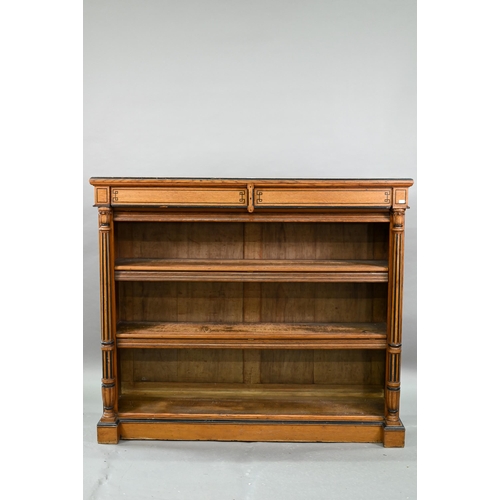 938 - A Victorian Gothic revival period oak and birch low open bookcase, the inverted breakfront top over ... 