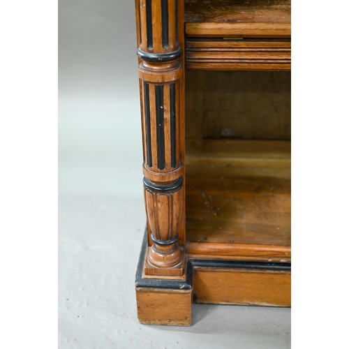 938 - A Victorian Gothic revival period oak and birch low open bookcase, the inverted breakfront top over ... 