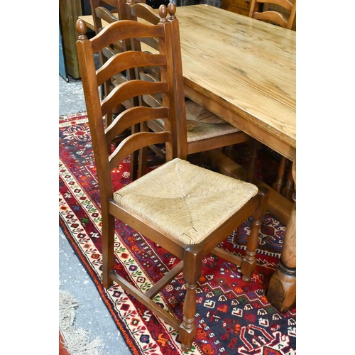 939 - A 17th century golden oak refectory table with baluster turned supports united by a centre stretcher... 