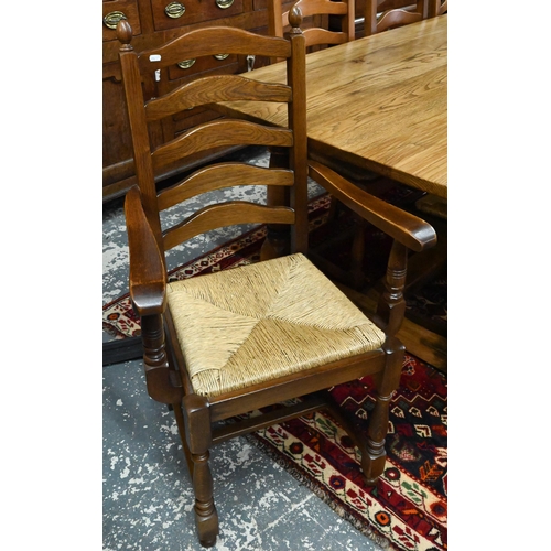 939 - A 17th century golden oak refectory table with baluster turned supports united by a centre stretcher... 