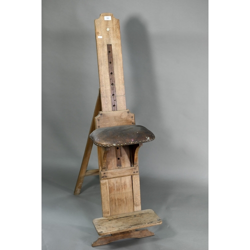 941 - Roberson & Co. London, an antique artists 'donkey' easel, with folding studded brown leather sea... 