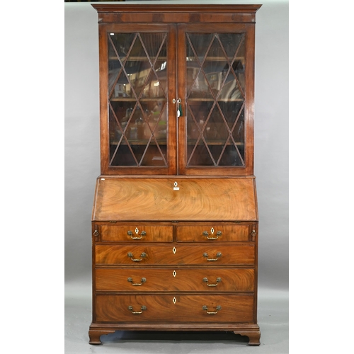 944 - A mahogany bureau bookcase, the upper with pair of diamond glazed enclosing adjustable shelves, the ... 