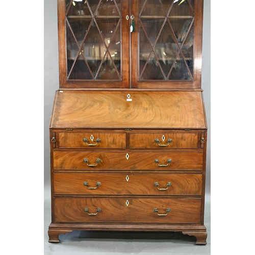 944 - A mahogany bureau bookcase, the upper with pair of diamond glazed enclosing adjustable shelves, the ... 