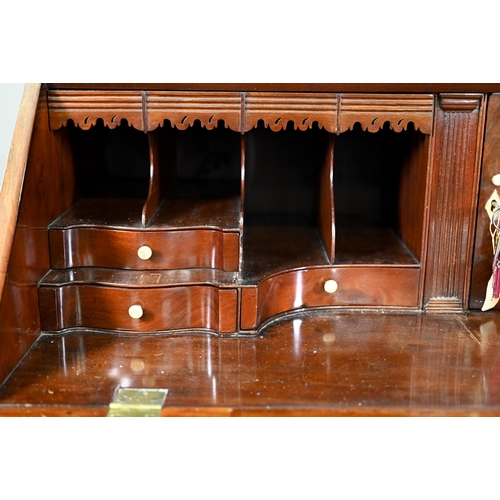 944 - A mahogany bureau bookcase, the upper with pair of diamond glazed enclosing adjustable shelves, the ... 