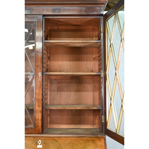 944 - A mahogany bureau bookcase, the upper with pair of diamond glazed enclosing adjustable shelves, the ... 