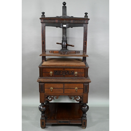 946 - An antique oak, walnut and marquetry book press, with two frieze drawers, raised on four bulbous sup... 