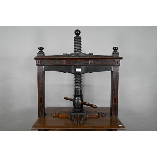 946 - An antique oak, walnut and marquetry book press, with two frieze drawers, raised on four bulbous sup... 